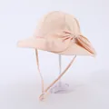 Detail view of pink kids sun hat with oversized bow and adjustable chin strap - Kids Adjustable / Khaki