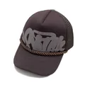 Close-up of brown trucker hat featuring graffiti lettering and breathable mesh back - Coffee