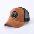 Detail of brown faux suede trucker hat with mesh back and circular Enjoy Life patch - Adjustable / Khaki