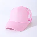 Close-up of pink trucker hat featuring breathable checkerboard mesh and decorative rope detail - Adjustable / Pink