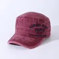 Close-up of vintage washed cotton cadet cap with youth embroidery and metal buckle details - Adjustable / Burgundy