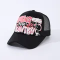 Black Working Hero trucker hat with pink graffiti print and breathable mesh back - Black
