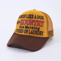 Close-up of vintage yellow and brown mesh trucker hat with retro slogan print - Yellow and Brown