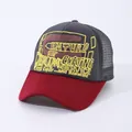 Detail of vintage foam print on mesh trucker hat with contrast brim and breathable back - Adjustable / Gray Top Wine Red Brim