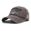 Detail of shark embroidery and American flag patch on washed cotton baseball cap - Coffee
