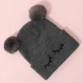 Close-up of cute eyelash embroidery and dual faux fur pom-poms on grey knit beanie - One Size / Gray