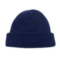 Detailed view of the dark blue knit beanie showing thick texture and ribbed design - Navy Blue / One Size