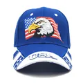 Detailed embroidery of an eagle and US flag on a navy blue baseball cap with USA brim text - Adjustable / Blue