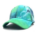 Detail view of cotton tie-dye baseball cap with blue-green gradient and curved brim - Adjustable / Blue and Green Tie-Dye