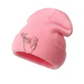 Detailed view of pink knitted beanie featuring silver butterfly and cross chain accessories - One Size / Pink