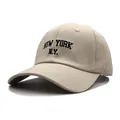 Close-up of NEW YORK N.Y. embroidery on beige cotton baseball cap with reinforced stitching - Adjustable / Beige