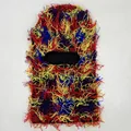 Colorful distressed knit balaclava mask with vibrant red, yellow and blue fringe accents - One Size / Colorful Camouflage