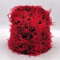 Red and black knit beanie featuring edgy fringe tassels and distressed camouflage texture - One Size / Black Red