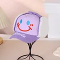 Detail of lavender winter hat with quilted fabric, fleece earflaps and smile embroidery - 52-54CM Head Circumference / Purple
