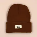 Deep brown knitted beanie for toddlers featuring a Mama's Mini patch on a pink background - 1-3 Years / Caramel color