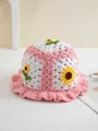 Detail of pink hand-crocheted bucket hat featuring yellow sunflower motifs and wavy trim - 56-59cm / Pink
