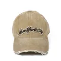 Close-up of khaki New York City embroidery on distressed washed cotton baseball cap - Adjustable / Khaki
