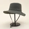 Detail of dark army green quick-dry sun hat with wide brim and adjustable chin strap - One Size / Green