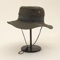 Detail of outdoor sun hat featuring gray webbing trim and side ventilation eyelets - Adjustable / Green