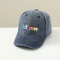 Close-up of kids' navy denim baseball cap featuring colorful cartoon train embroidery - 2-6 Years (48-52cm) / Navy Blue