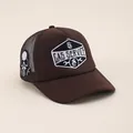 Detailed embroidery of GAS SERVICE patch and skull logo on brown trucker hat - Adjustable / Coffee