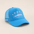 Top view of blue trucker hat featuring white star embroidery and mesh panels details - Adjustable / Sky Blue
