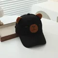 Kids black baseball cap featuring cute capybara embroidery and small plush bear ears - Adjustable Kids Size / Black
