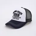 Detail of Golden State embroidery on a mesh trucker hat with blue brim and white front - Adjustable / Navy Blue