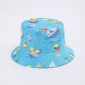 Close-up of blue sun hat with yellow duck and sailboat pattern for summer protection - Blue Duck Sailboat Print