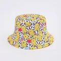 Detailed pattern of small yellow duck prints on a white bucket hat with geometric shapes - White Dense Duck Geometric Blocks