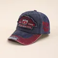Detail of vintage navy cotton baseball cap with New York embroidery and distressed brim - Navy Blue