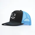 Detail of curved brim trucker hat with smiley face patch and breathable mesh paneling - Black and Blue