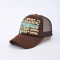 Detail of brown trucker hat featuring 3D puff print lettering and breathable mesh back - Adjustable / Brown