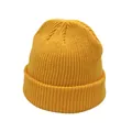 Close-up of ginger yellow ribbed knit beanie featuring classic rolled edge texture - One Size / Yellow