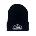 Black knitted beanie featuring white star embroidery and cuffed design for streetwear style - Black