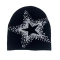 Knitted black beanie featuring white pixelated star patterns for winter casual wear - Black