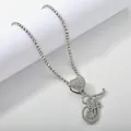 Macro shot of silver letter F iced out pendant on shimmering heart tennis chain - Silver Set F