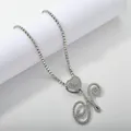 Detail of silver tennis chain with heart accent and iced-out cursive letter H pendant - Silver Set N