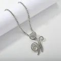 Macro view of silver heart pendant with iced out cursive letter N on tennis chain - Silver Set W