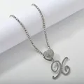 Macro detail of silver tennis chain with iced out heart and cursive letter X pendant - Silver Set X
