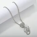 Macro detail of silver tennis chain with iced out heart and cursive letter Y pendant - Silver Set Y