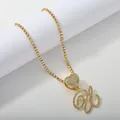 Iced out tennis chain with heart connector and cursive letter W pendant in gold - Gold Set U