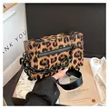 Detail of leopard print crossbody bag with black thick chain and textured faux leather surface - Khaki
