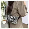 Crossbody leopard print small square bag with chunky black chain strap on model - Gray