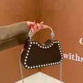 Coffee brown hard shell evening bag with silver rivets and sleek metallic handle - Coffee