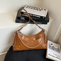 Chic brown retro chain underarm bag in glossy crinkled faux leather finish - Brown