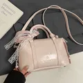 Pink PU leather pillow handbag with bow detail and adjustable shoulder strap - No Pendant / Pink