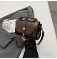 Dark brown leather handbag with vintage gold buckle and stylish top handle - Brown