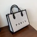 Minimalist large beige tote bag with black leather trim and PARIS print - Large / Black