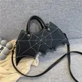 Gothic bat-shaped handbag in black PU leather with white spiderweb stitching and crossbody strap - Medium / Black
